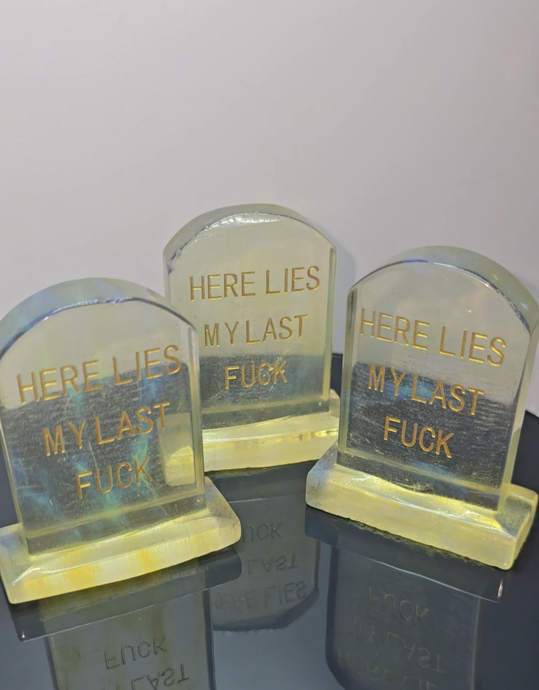 Crystal tombstones carving, here lies my last. / Funny saying
