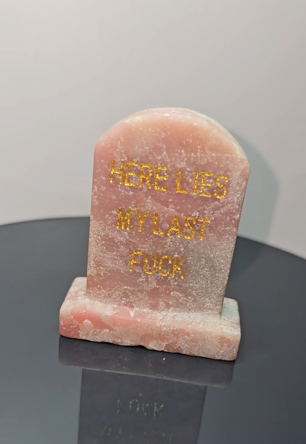 Crystal tombstones carving, here lies my last. / Funny saying