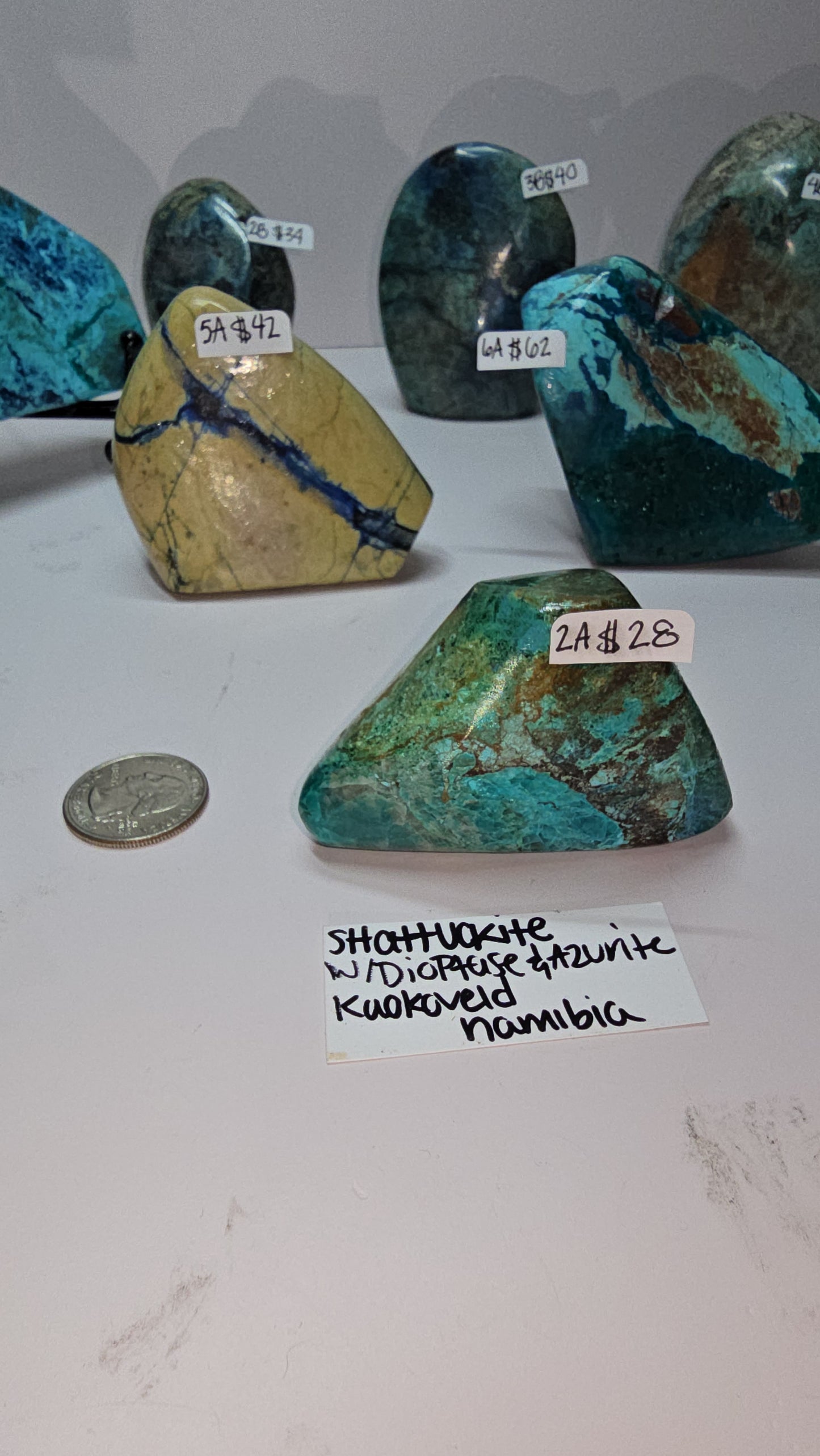 Mix of polished shattuckite freeforms (some with dioptase) from Kaokoveld, Namibia