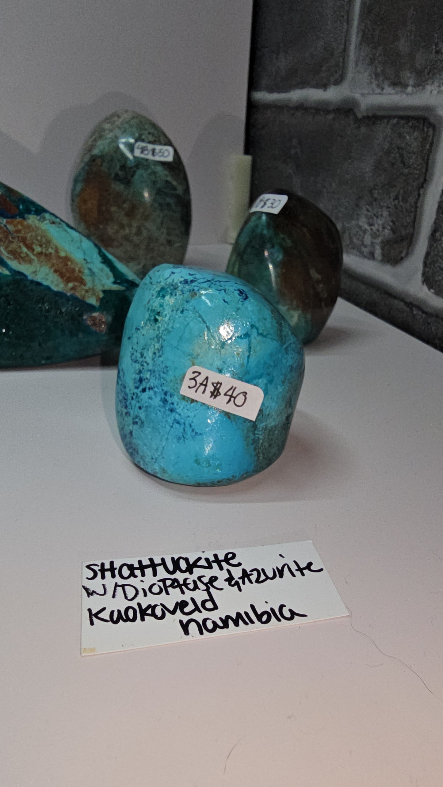 Mix of polished shattuckite freeforms (some with dioptase) from Kaokoveld, Namibia